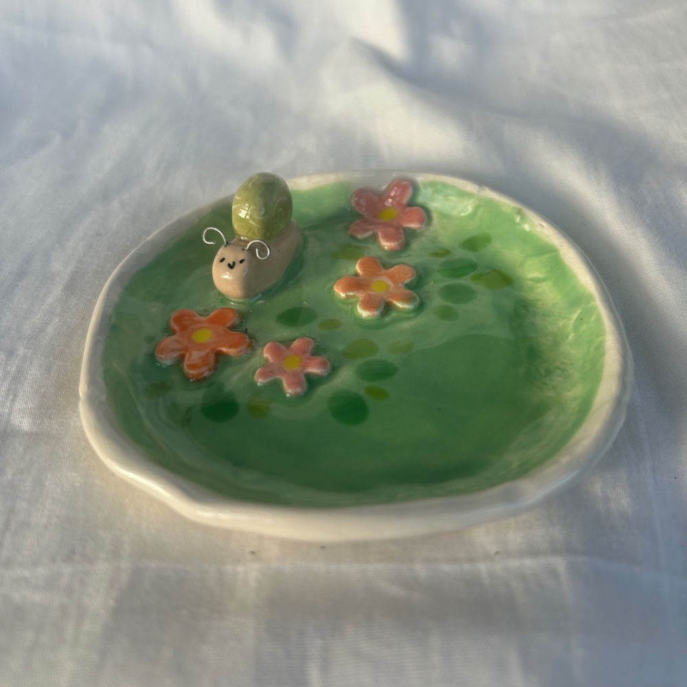 Snail & flower ceramic trinket dish .