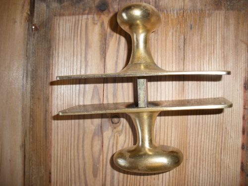 Pair of original brass oval door handles.