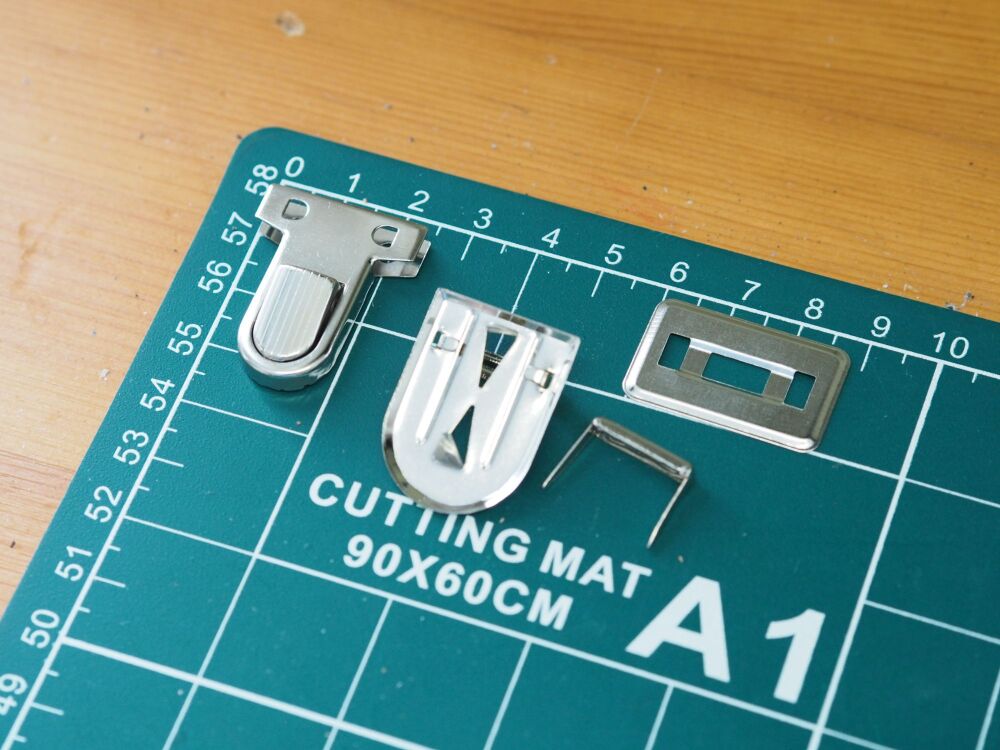 Silver coloured Tuck locks