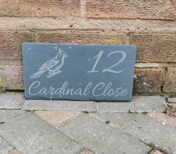 House sign with tree with cardinal bird image