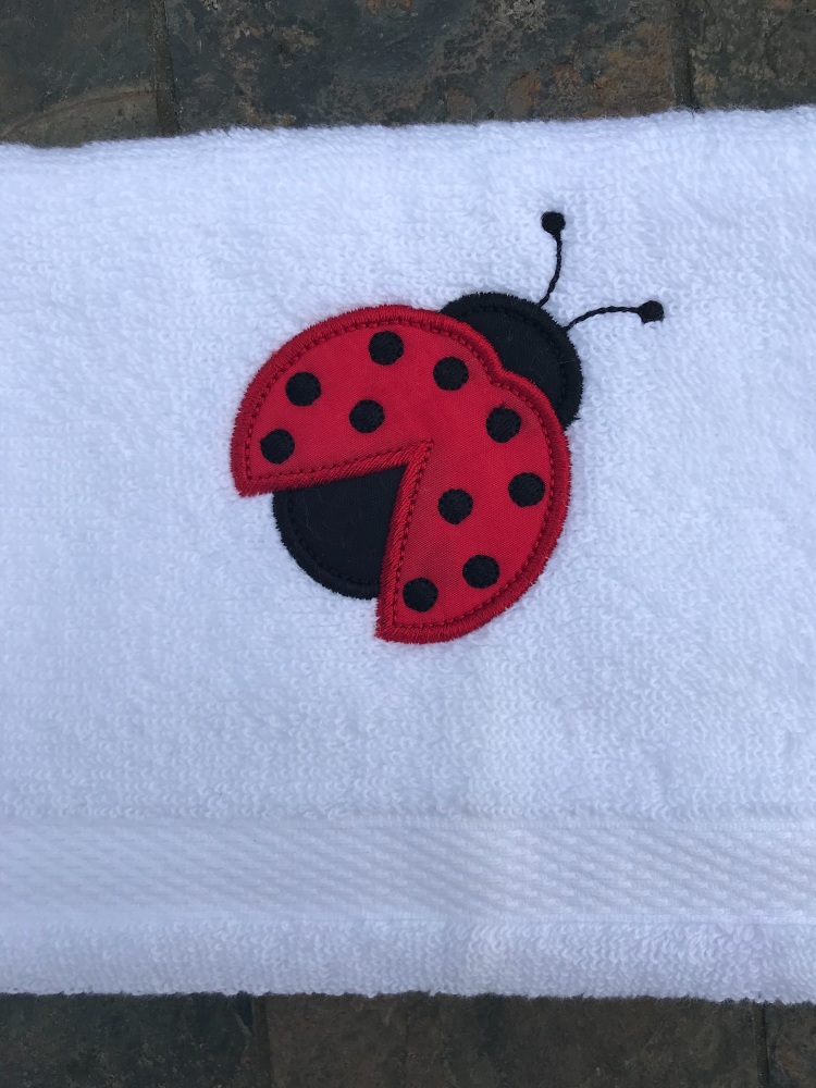 Ladybird appliqué hand towel 