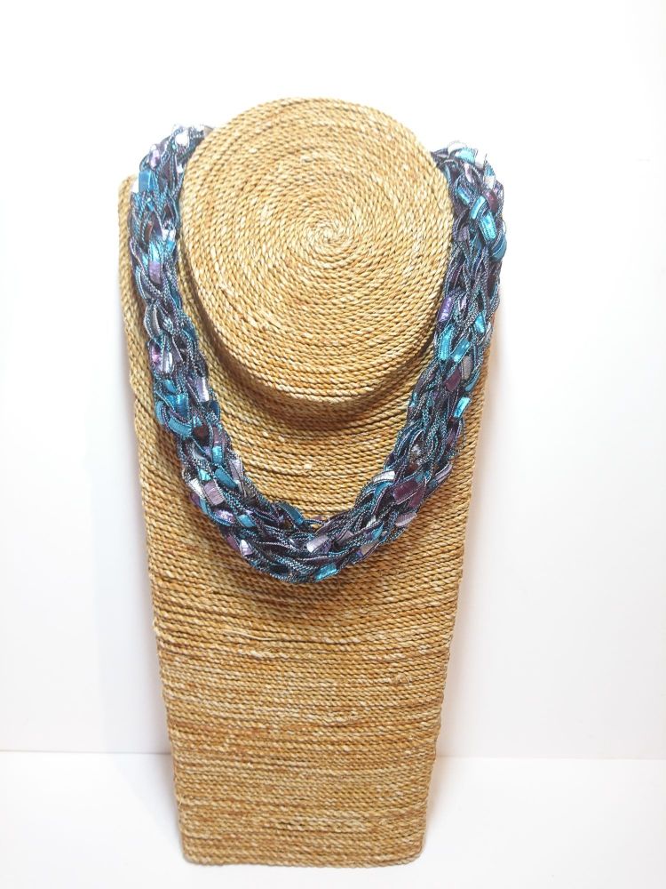 Finger knitted necklace in turquoise, purple and blue