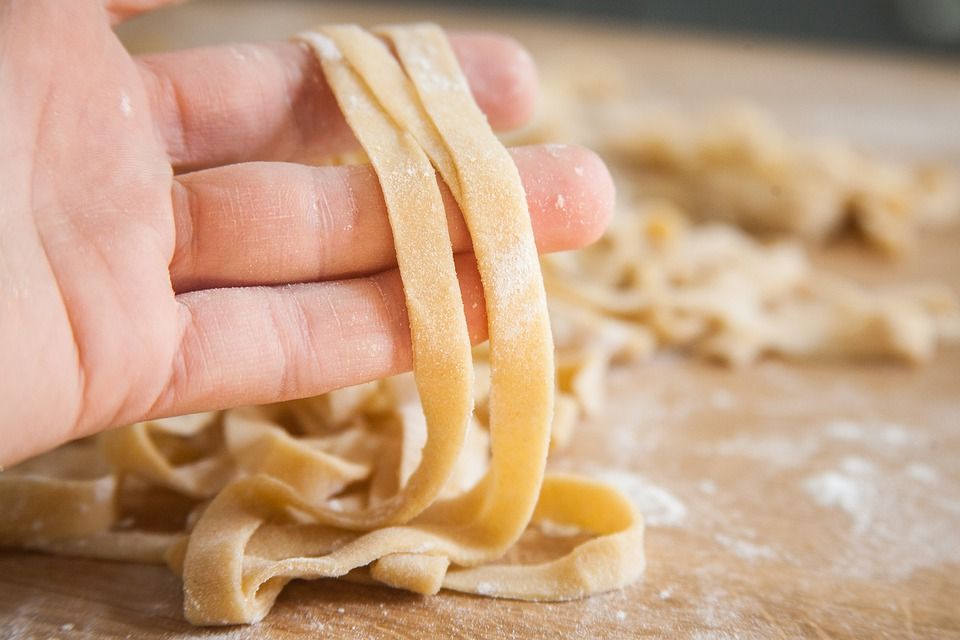 Hand holding pasta