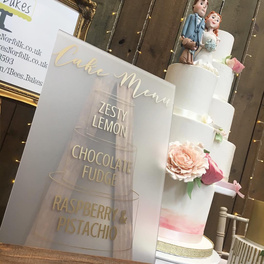 Wedding cake menu on frosted perspex
