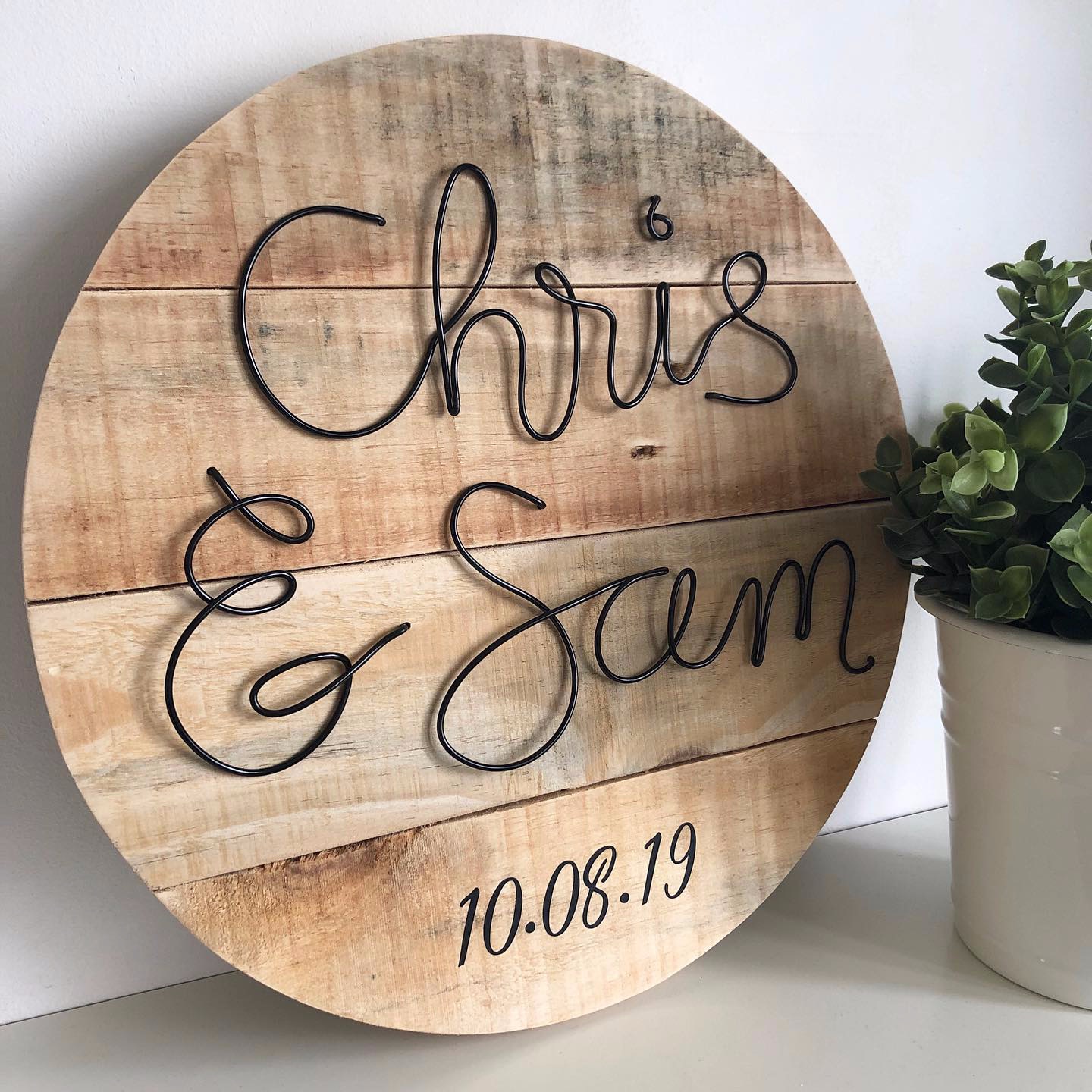 Reclaimed pallet wood sign with wire and vinyl letter detail