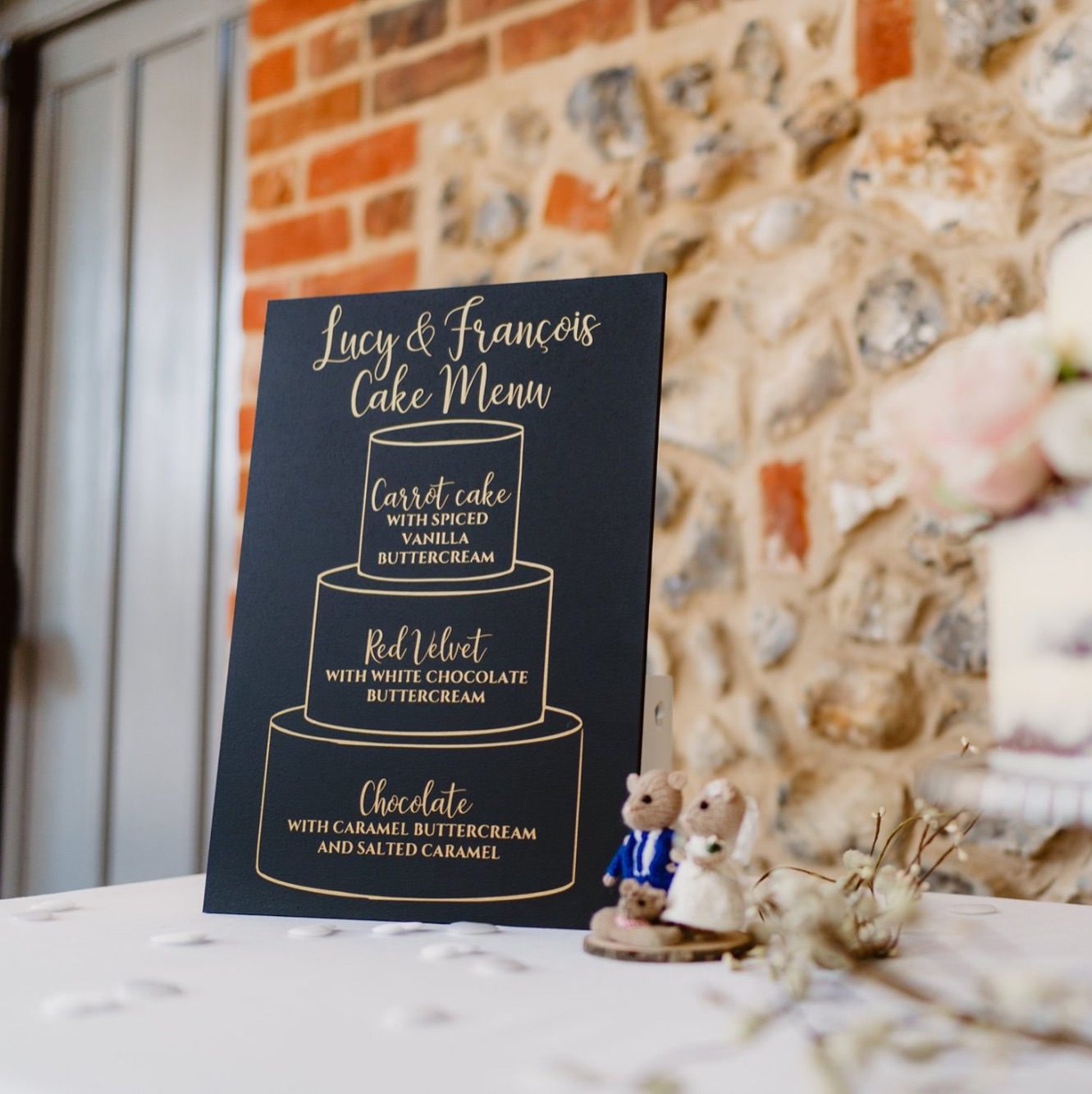 Cake menu on chalkboard with gold vinyl design