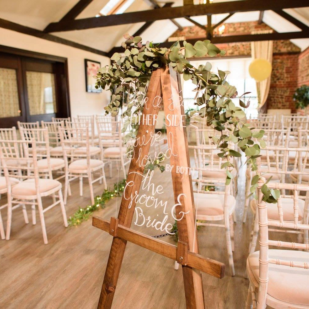 clear perspex ceremony sign 'pick a seat either side'