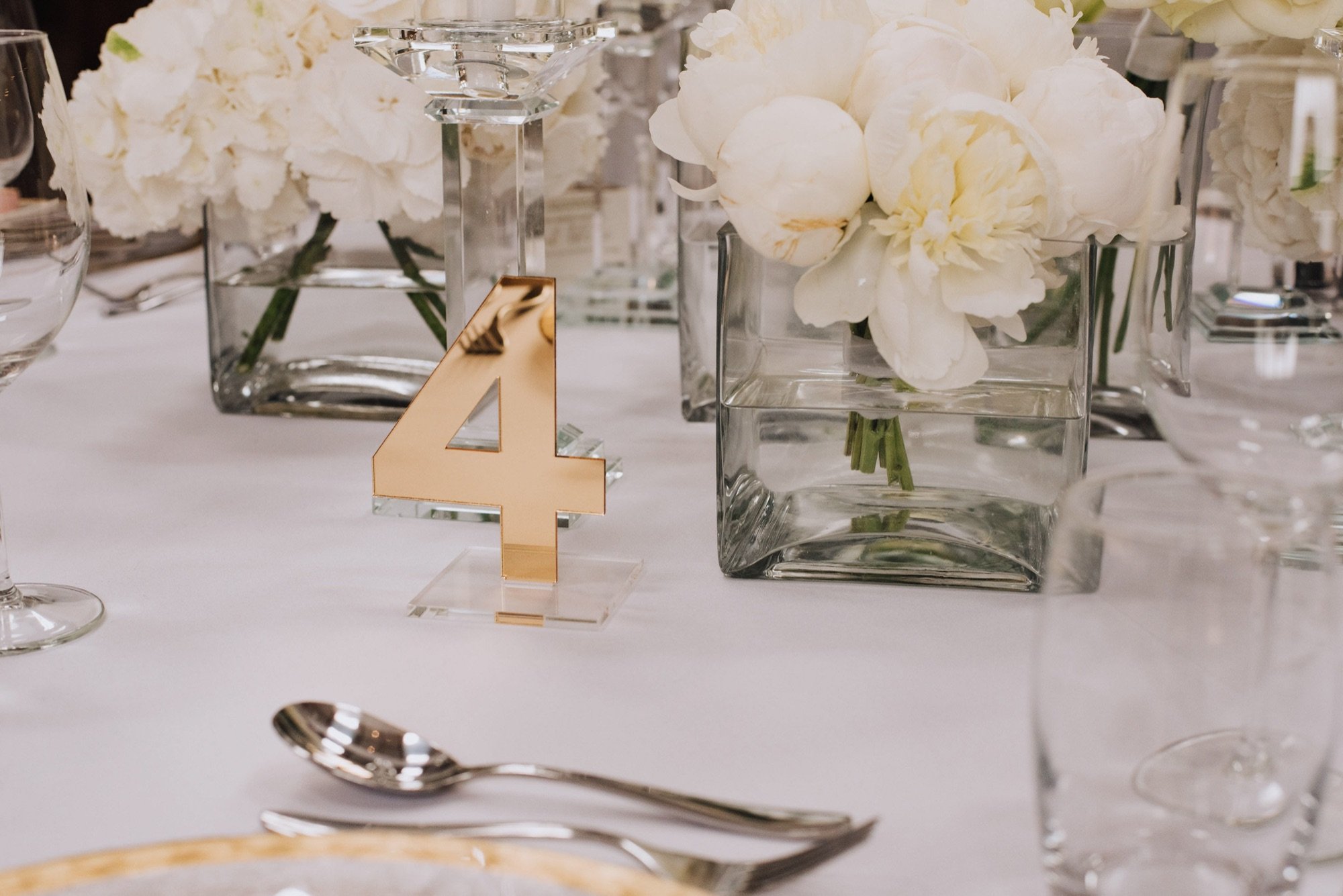 Clear acrylic table number with purpel vinyl lettering
