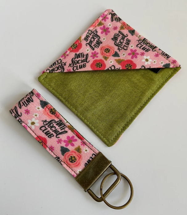 a cloth page corner bookmark and fabric keyring using pink flowery anti-social club fabric