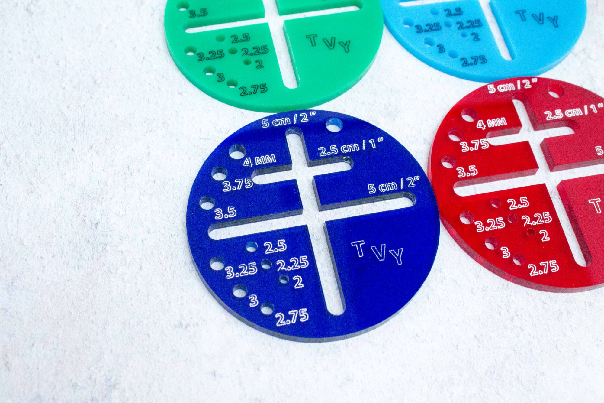 acrylic circular gauges with 2 inch and 1 inch crosses in the middle and holes for needle sizing up to 4mm
