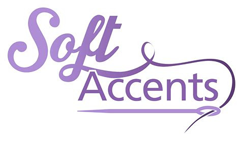 soft accents logo purple text on a white background with a swirl that looks like thread going into a needle that lays across the bottom