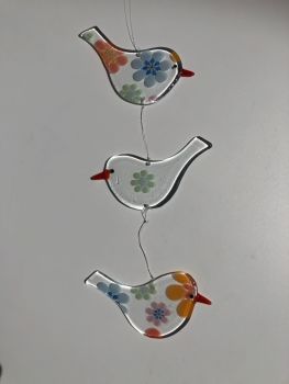 Trio of clear glass hanging Birds with multi floral design 