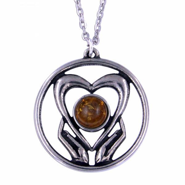 Holding onto love pendant by St Justin of Penzance