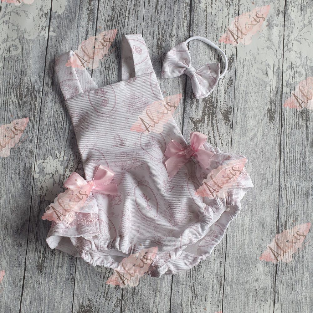 Frilly bum pink cherub romper 