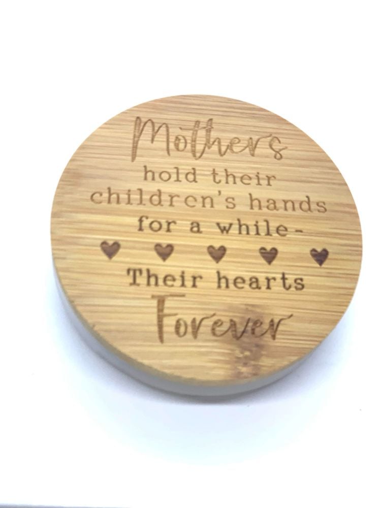 Mothers hold their children's hands for a while - their hearts forever