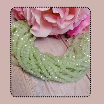 1 x 17 inch strand approx, 4x3mm crystal rondelles opaque pale green