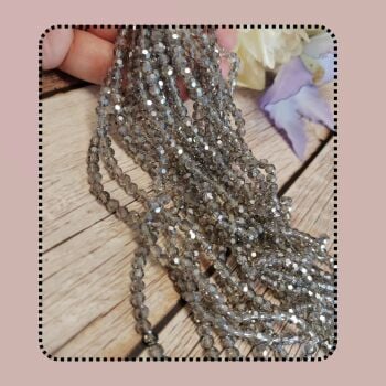 1 x 7 inch strand 4x3mm crystal rondelles, half electroplated. Silver grey