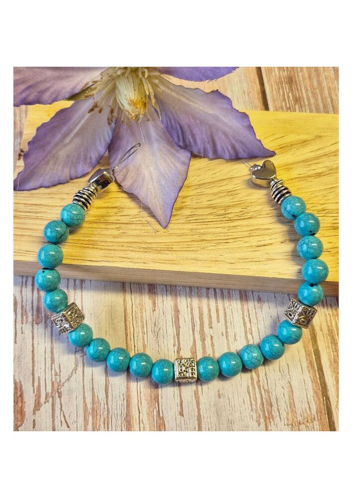 1 x 9.5 inch strand with acrylic and metal large hole beads