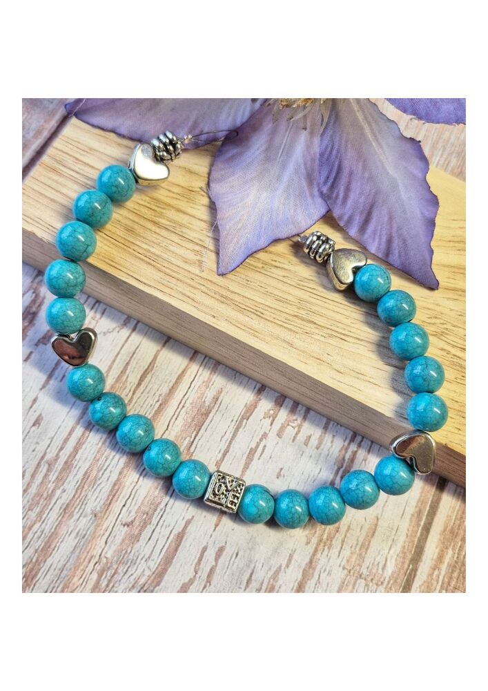 1 x 9.5 inch strand with acrylic and metal large hole beads