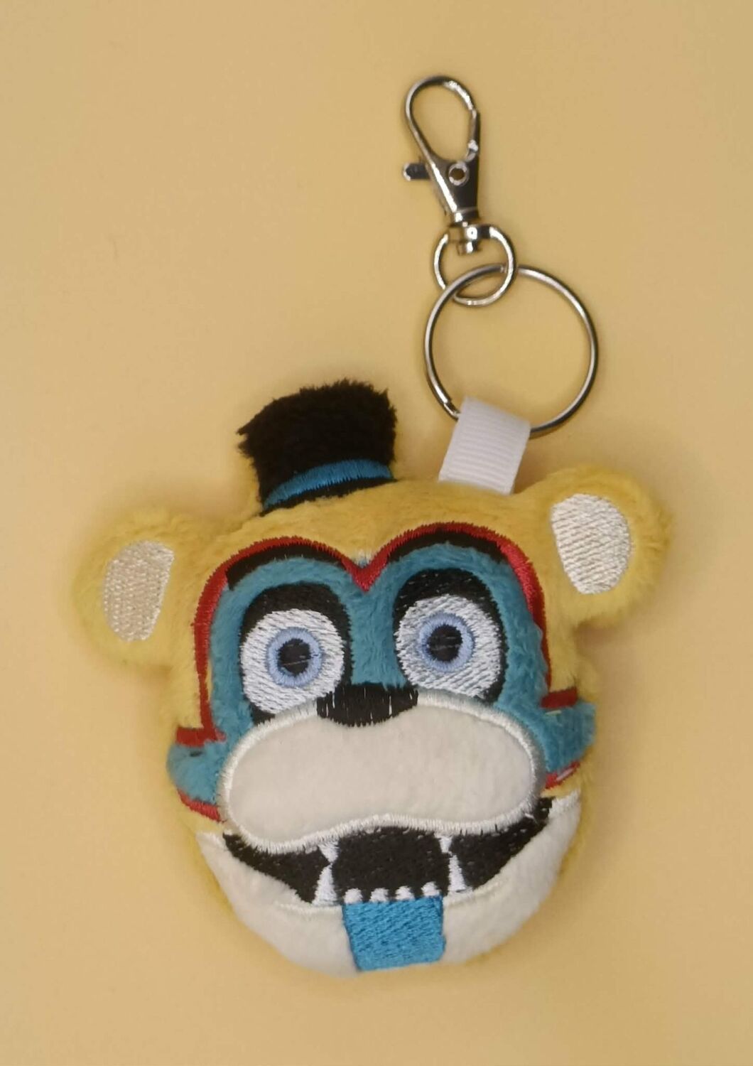 FNAF Glamrock Freddy Inspired Plush Head Keyring.