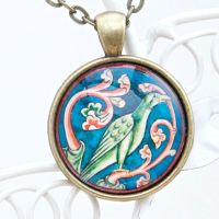 Phoenix from a bestiary,  manuscript pendant