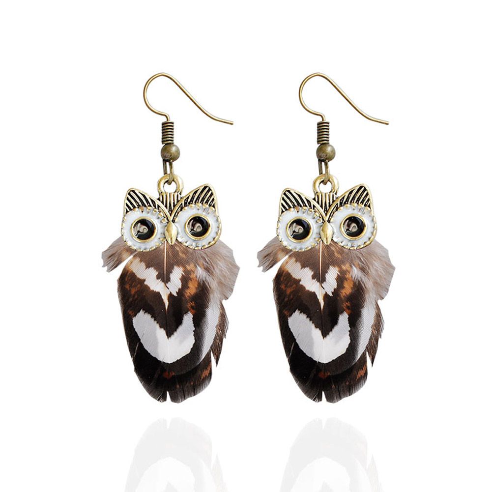 A pair of feathered owl earrings