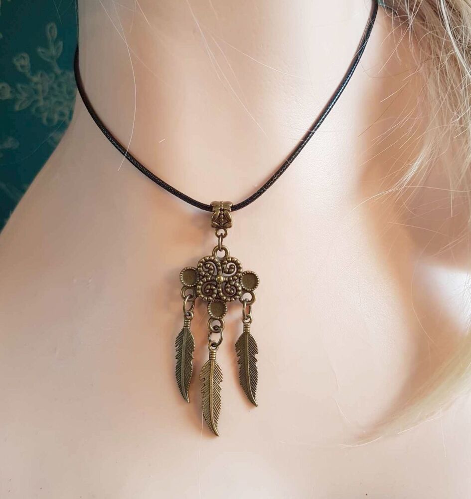 Feather Pendant Statement Necklace with Bronze Detail and Black Cord