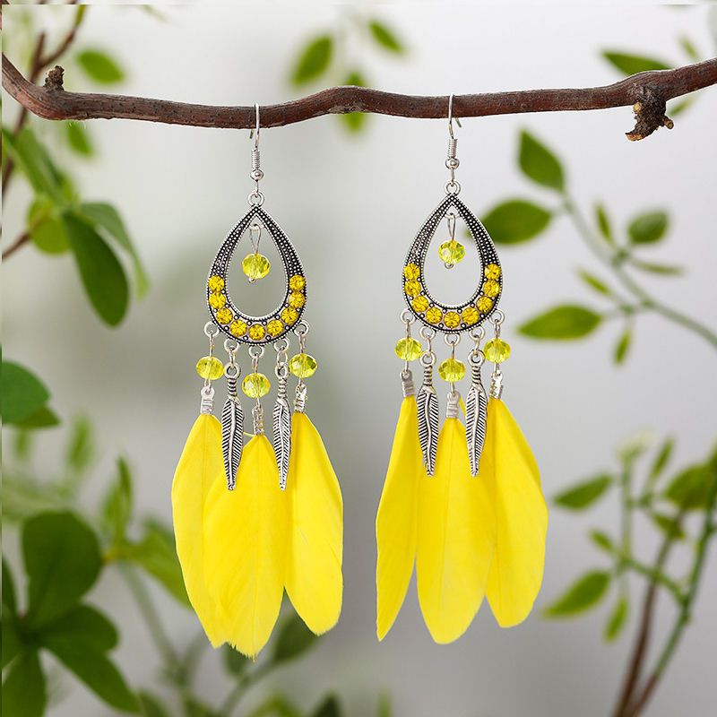 Yellow Feather Earrings with Rhinestones, Beads & Silver Charms