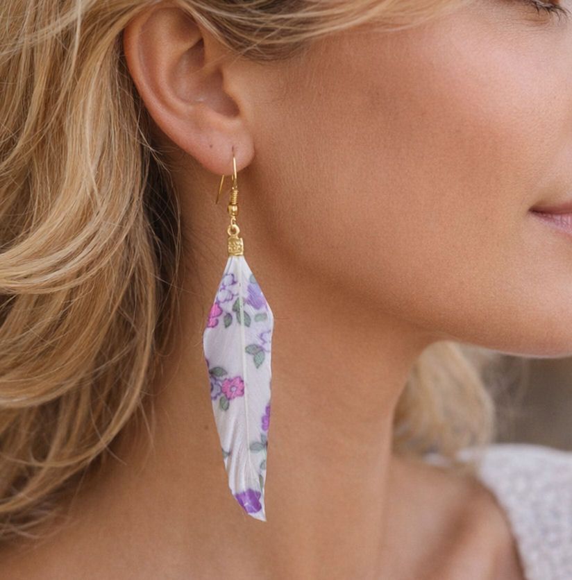 Woman wears Feather Earrings with Floral Print Pattern