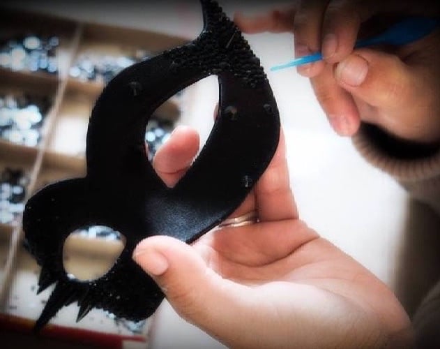 A black Venetian mask  having Swarovski Crystals applied