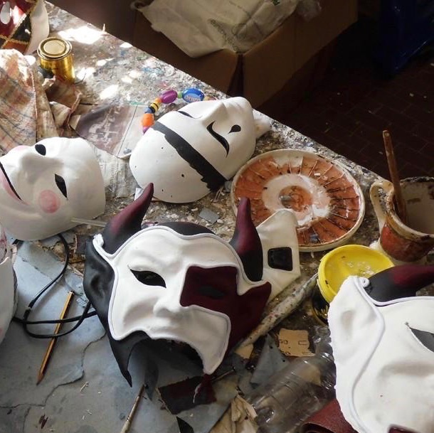 A homemade masquerade mask being decorated
