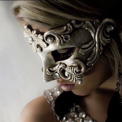 beautiful woman at a party wearing a luxury masquerade mask