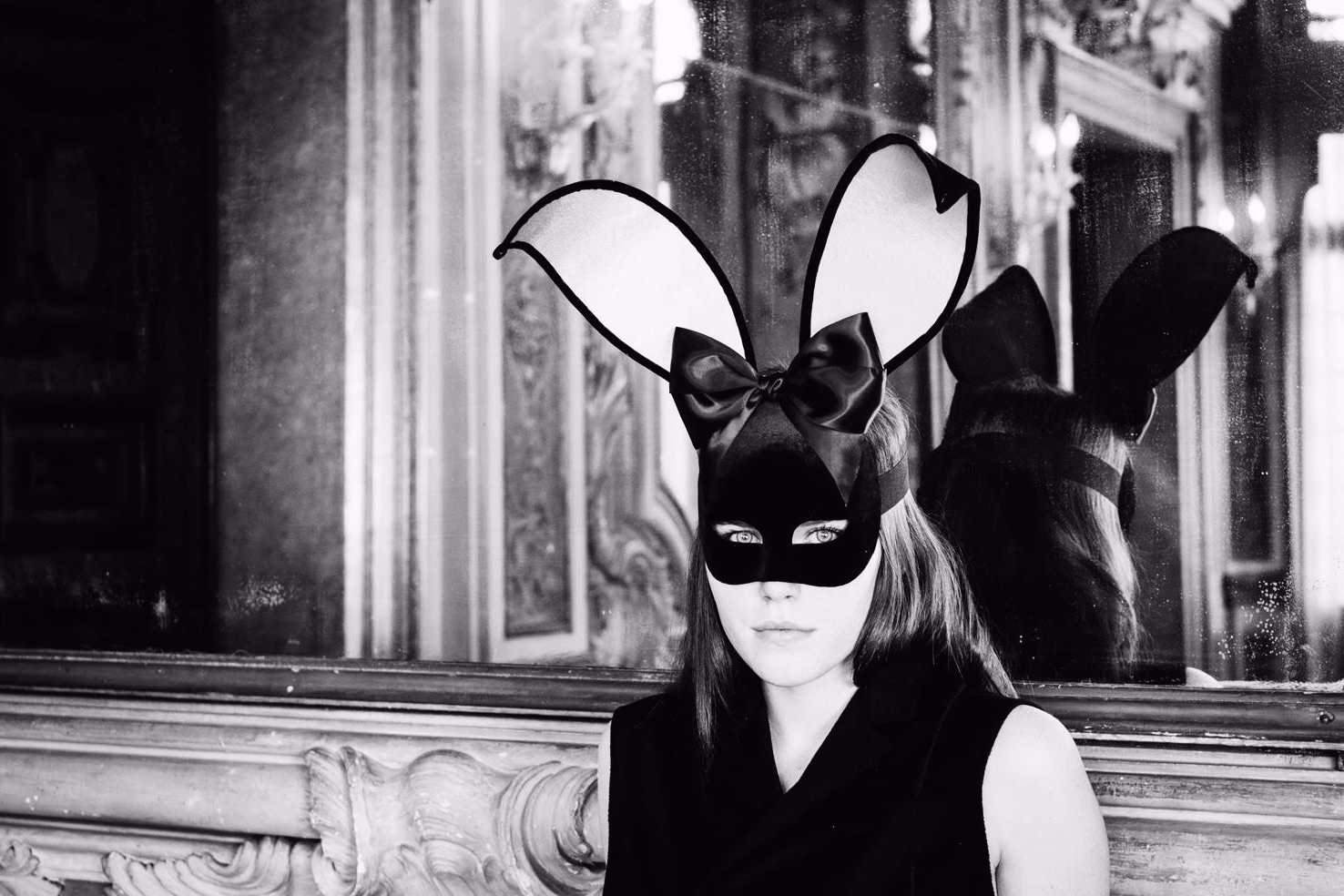 stunning dark haired woman wearing a bunny girl mask