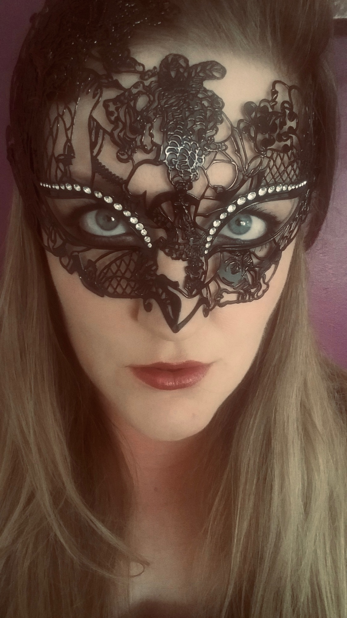 beautiful lady customer  wearing a filigree masked ball mask - Image