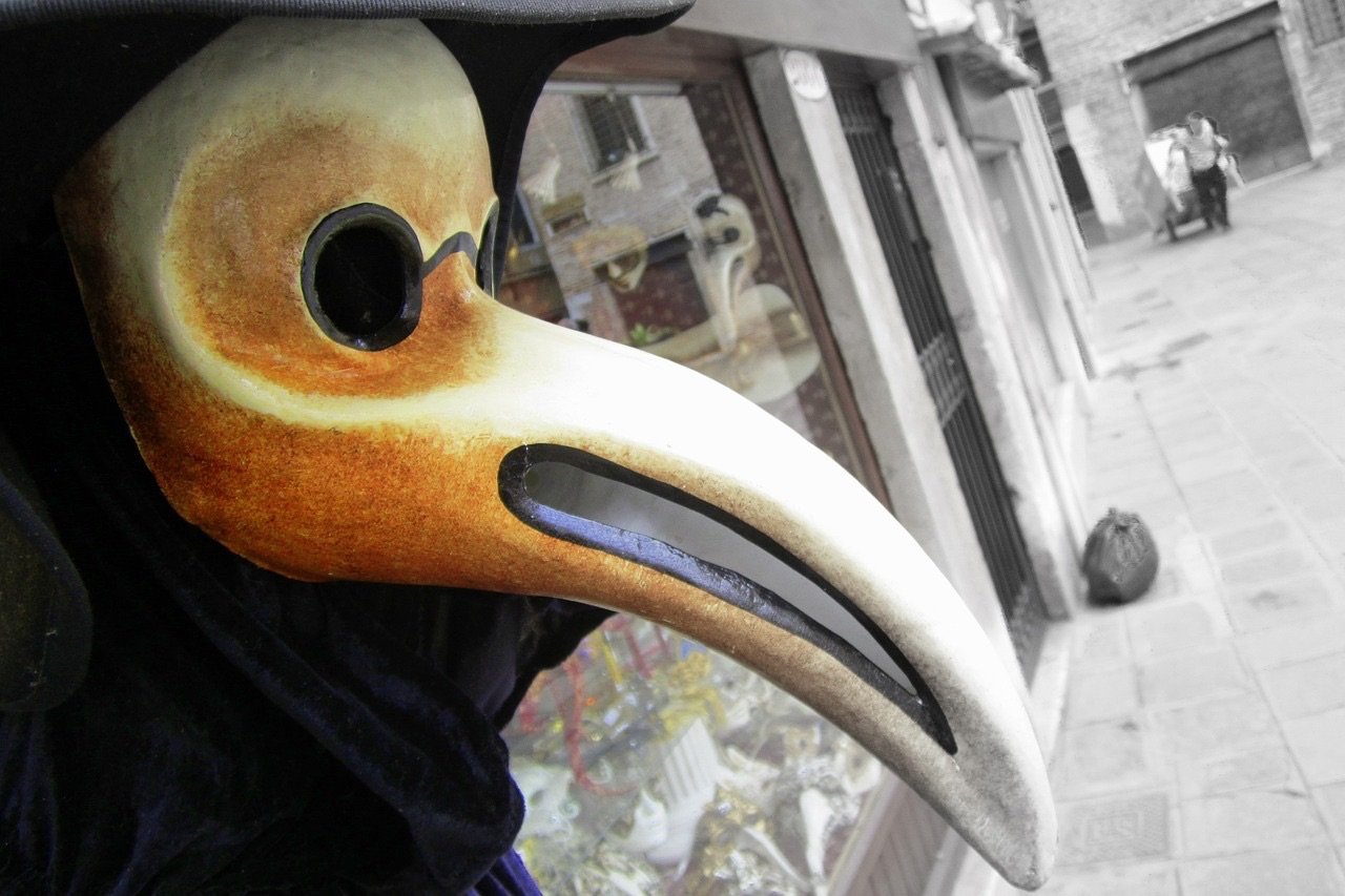 plague doctor mask and costume outside a mask shop in Venice