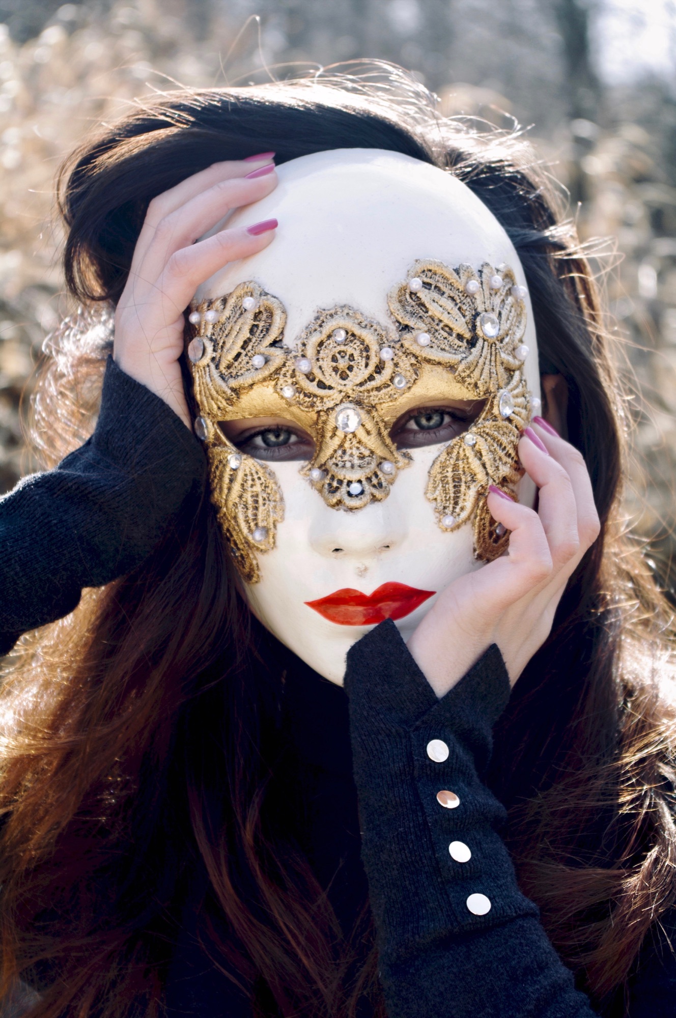 stunning dark haired woman wearing one of our full face venetian masks