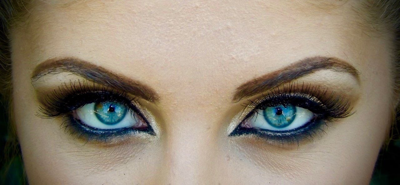 beautiful eyes of a woman showing off her makeup ready for a masked ball