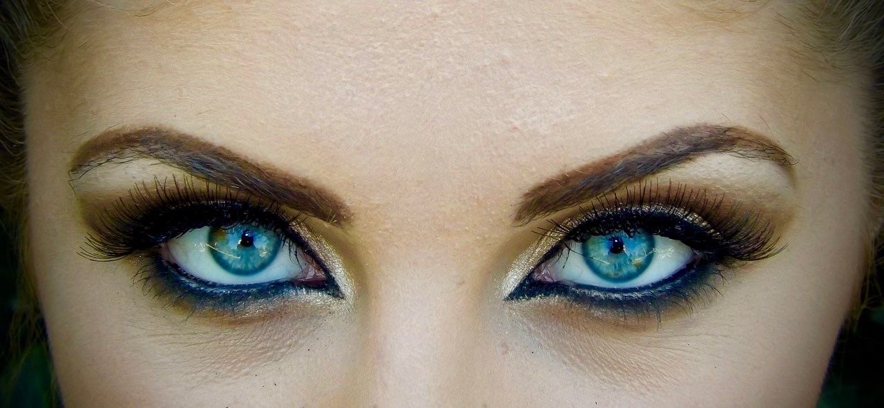 beautiful eyes of a woman showing off her makeup ready for a masked ball