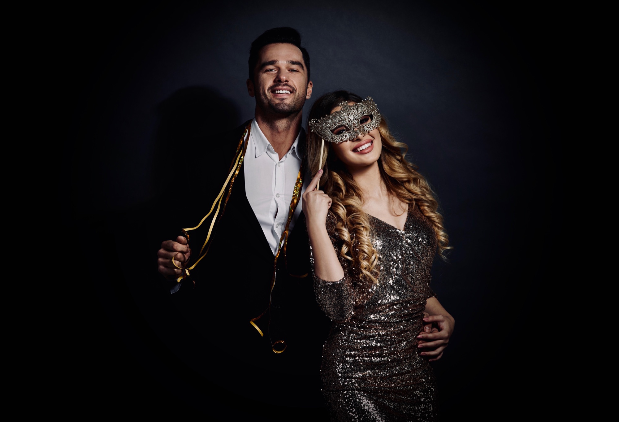 A Couple Attending A Formal Masquerade  Ball