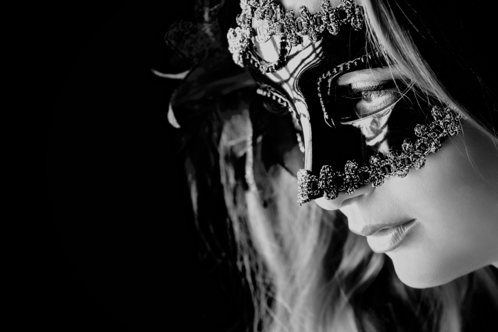 Elegant masquerade masks worn at a masquerade event
