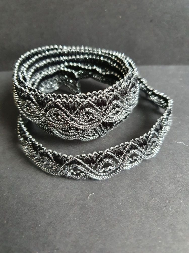 Silver and black looped braid