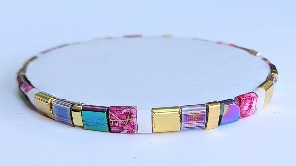 Tila Bead Bracelet with gold and pink accents on stretch elastic
