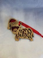 Highland Coo Wearing a Santa Hat Hanging Tartan Plaque with Year
