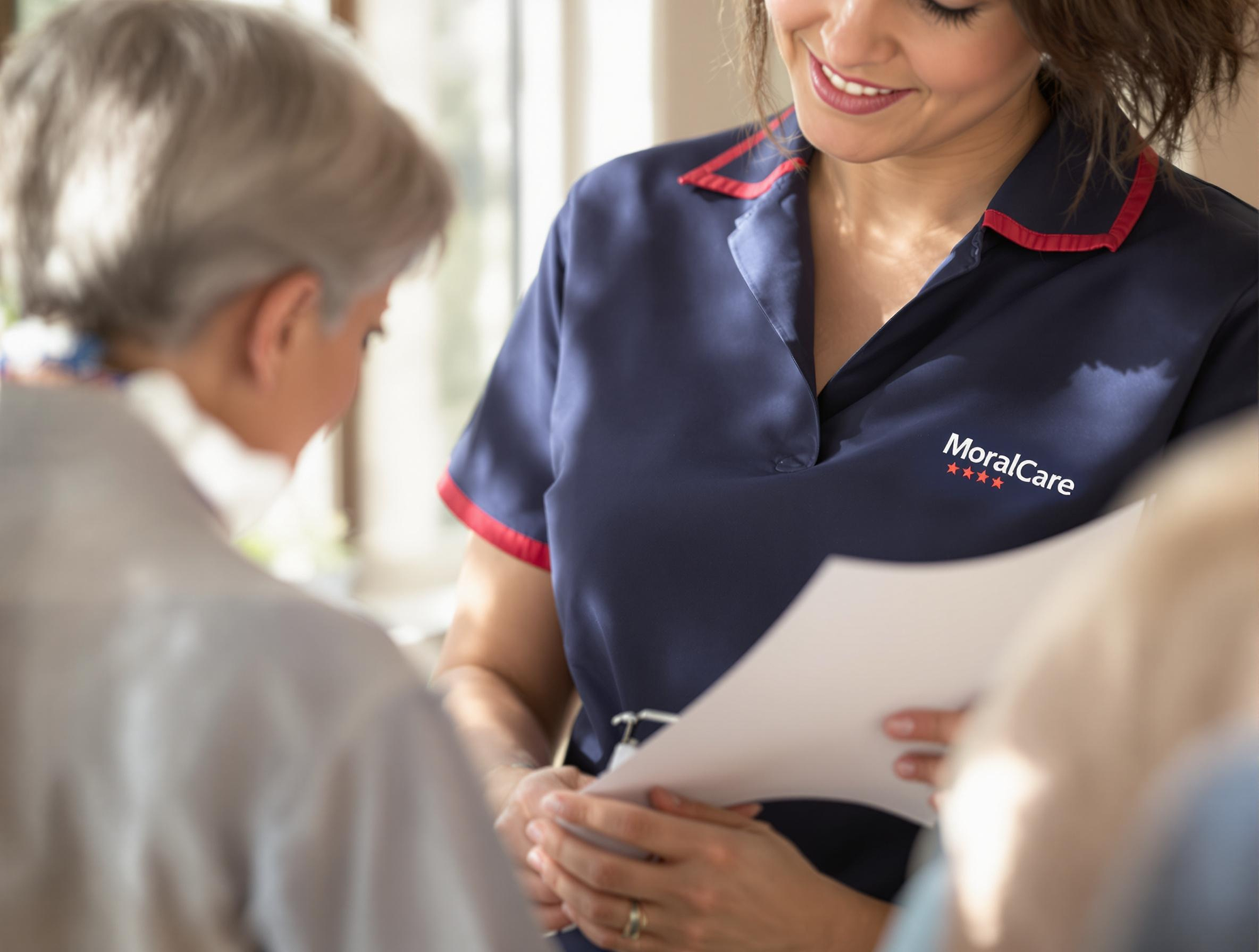 carer talking to an elderly person