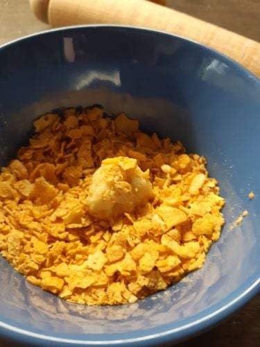Easy biscuit recipe rolling in cornflakes