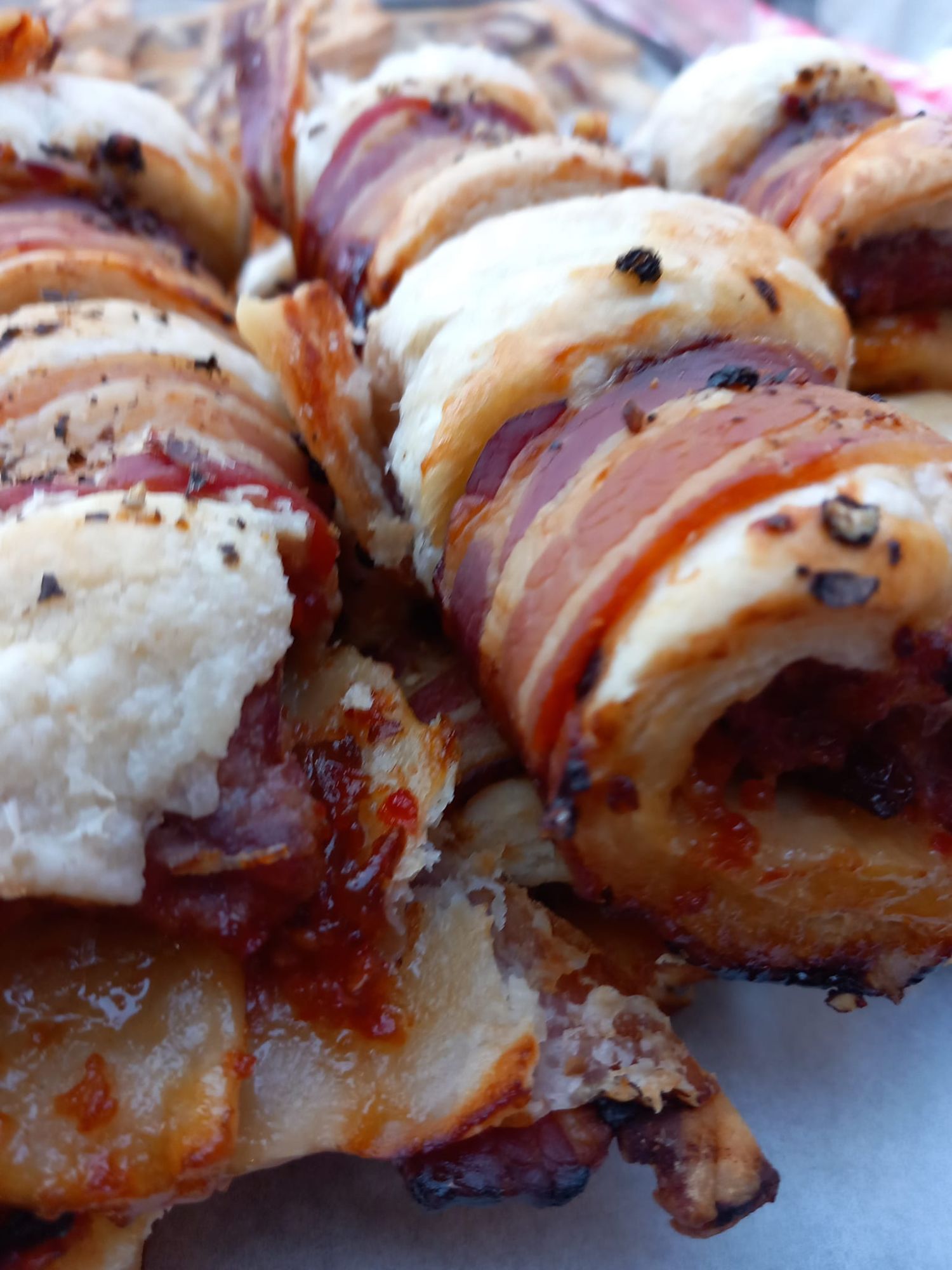 Sausage rolls wrapped in bacon at the Starting gate Beer festival