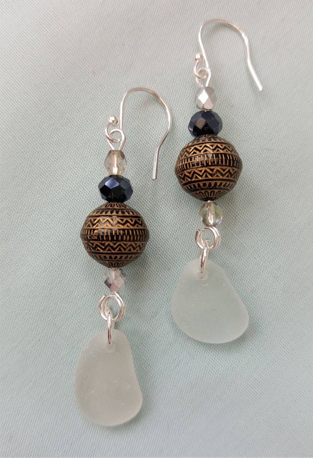 White sea glass with patterned beads