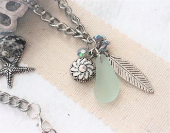 Sea glass beads and a leaf