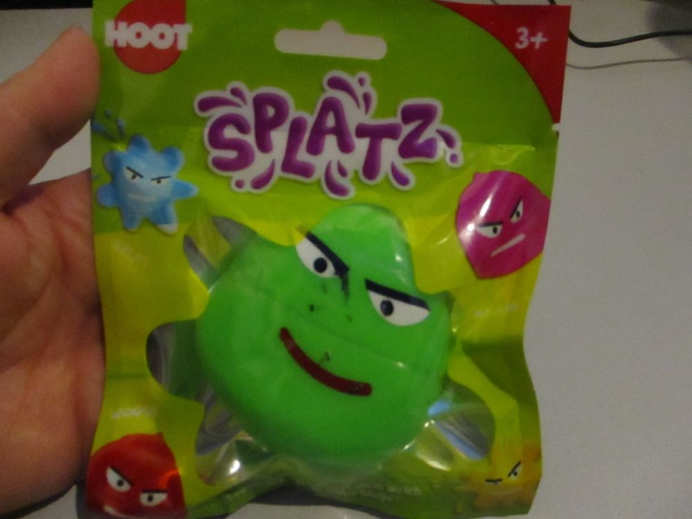 Green Splatz Face Ball Pocket Money Toy