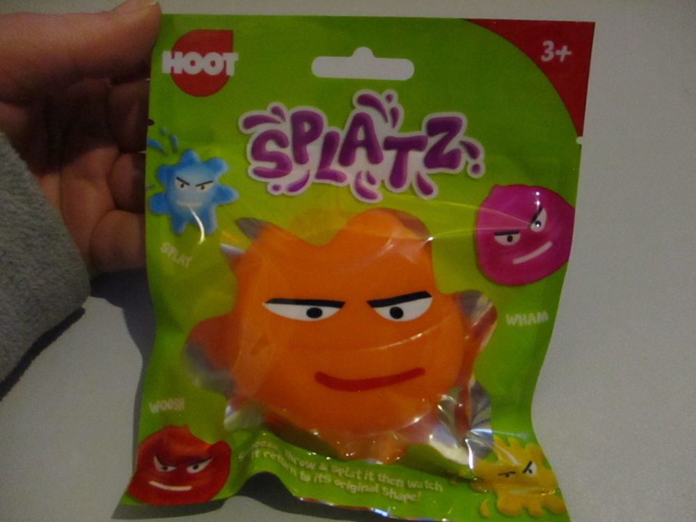 Orange Splatz Face Ball Pocket Money Toy